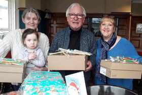 Marianna Mitchell with granddaughter Paiton Ackroyd, Syd and Sheree Little and some of the shoe boxes and goodies at the Steamer pub, Fleetwood.