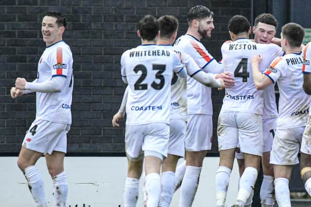 Connor Barrett is congratulated by his AFC Fylde team-mates after opening the scoring Picture: Steve McLellan