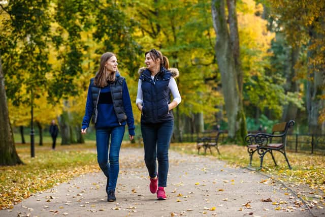 Walking instead of driving reduces air pollution and carbon emissions. Photo: Adobe