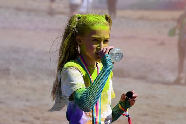 A brief water break for this young participant in the Blackpool Colour Run