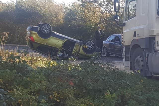 A car overturned following a two-vehicle crash in Common Edge Road