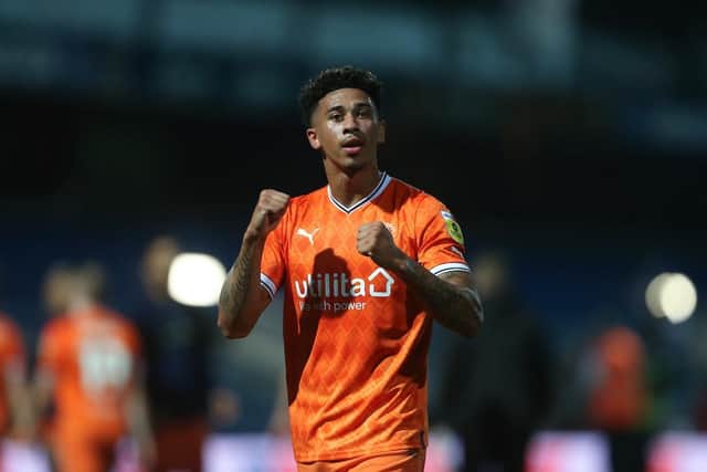 Jordan Gabriel celebrates with the Blackpool fans at the full-time whistle