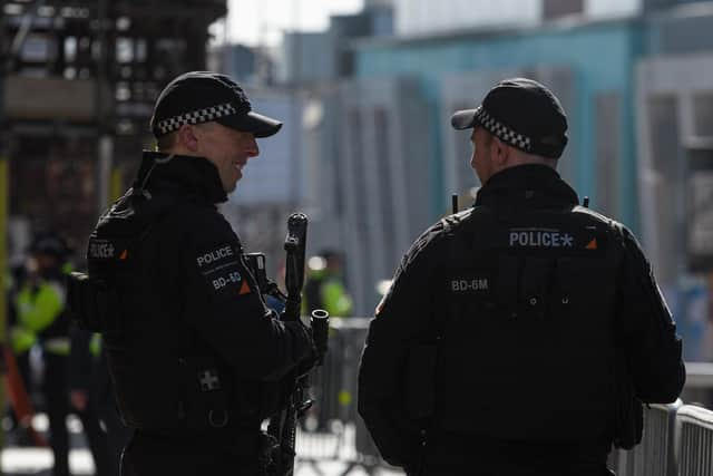 Armed police outside the Winter Gardens as the Conservative Party Conference arrives in Blackpool. Photo: Kelvin Stuttard