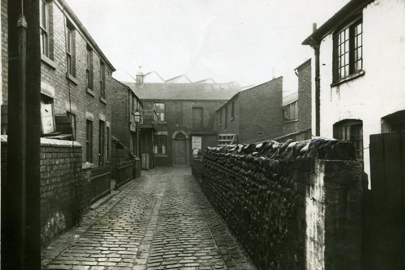 Wilkinson's Yard was off Bonny Street and can be seen near the centre of the section enlarged from an original photograph of Central Station. The V shaped roofs of Central Station can be seen above the property at the end of the yard.