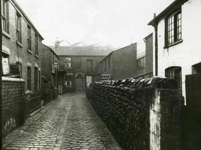 Wilkinson's Yard was off Bonny Street and can be seen near the centre of the section enlarged from an original photograph of Central Station. The V shaped roofs of Central Station can be seen above the property at the end of the yard.