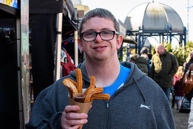 Lewis Stanley with a churro at St Anne's Food and Drink Festival 2022. Photo: Kelvin Stuttard
