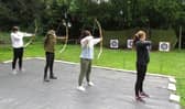 A group picture of all the youngsters and other pictures of various activities taking place at the Youth holiday held at Borwick Hall, including canoeing, kayaking, team games including tug-o-war, low ropes course and archery