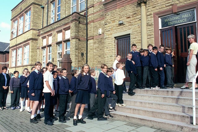 Pupils at St. John's Primary School in Blackpool on the steps of the Masonic Hall in Blackpool where they were taught during renovations at school in 1999