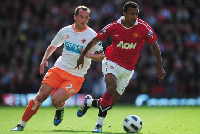 MANCHESTER, ENGLAND - MAY 22:  Luis Nani of Manchester United evades Charlie Adam of Blackpool during the Barclays Premier League match between Manchester United and Blackpool at Old Trafford on May 22, 2011 in Manchester, England.  (Photo by Shaun Botterill/Getty Images)