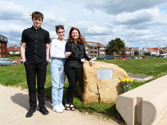 Mike's wife Louise and children Leo and Emily with the plaque tribute.