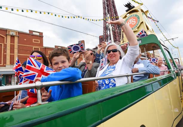Thousands of people lined Blackpool promenade to see a parade of heritage trams, in association with Blackpool Transport, to celebrate the Queen's platinum jubilee.