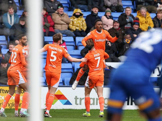 Karamoko Dembele celebrates scoring against Shrewsbury earlier this month