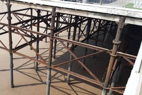 More of the steelwork  at South Pier is now exposed above the sand