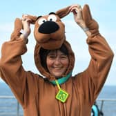 Alison Johnson dressed as Scooby Doo for a nine mile walk in memory of her late rescue dog Koona, with Anne Pratt and Ebony and Skye