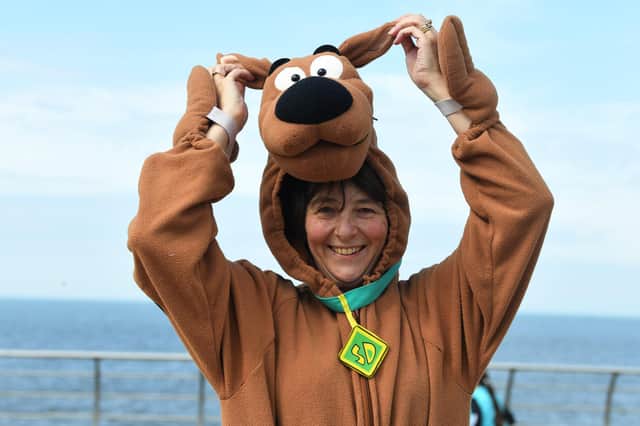 Alison Johnson dressed as Scooby Doo for a nine mile walk in memory of her late rescue dog Koona, with Anne Pratt and Ebony and Skye