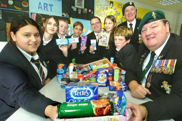 Pupils at Palatine High School, Blackpool, have been collecting for the Gazette "Help Our Heroes" campaign. Pictured (from left): Aimee Malalla, Victoria Brown, Aaron Millgate, Charlie Oates, Mr John Cartmell (form tutor), Kara-Jay Russell, Declan Boyle and veterans Ray Saunders and Mike Warren