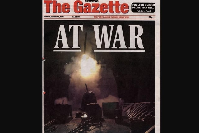 A dark front page with the words 'At War' illustrated the US invasion in Afghanistan on October 5 2001