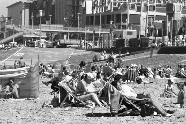It must have been a miserable summer because the caption on the back of this photo reads:  'Shock appearance of the sun sent youngsters of all ages on to the beach at Blackpool, scratching their heads and trying to remember how to tackle a real summer. Swim suits came out, buckets and spades were dusted down and, for the first time this year, sandcastles proliferated along the shore, with the occasional father buried beneath them'