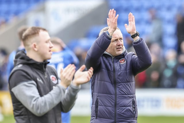 Neil Critchley applauds the fans at the final whistle.