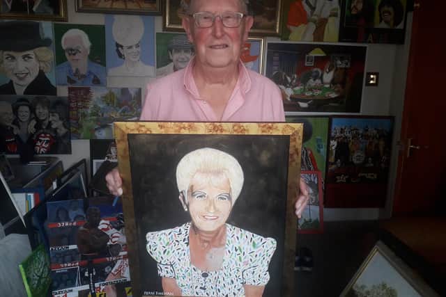 Frank Fineman with his painting of wife Ruth