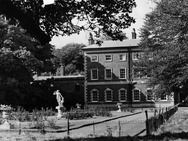 A side view of Lytham Hall - ancestral home of the Clifton family, Squires of Lytham in 1957. The present day Georgian building was designed by eminent architect John Carr of York and was completed in 1764. The garden pictured is today a car park