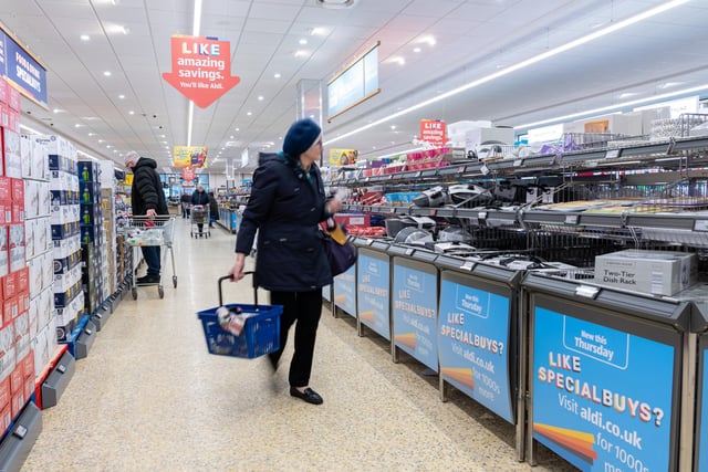 A customer checks out some of the Betterbuy deals  in the aisles in the recently refurbished Aldi in Poulton-le-Fylde. Photo: Kelvin Stuttard