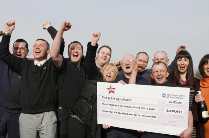 Members of staff from A.S.K. Rewinds Ltd in Accrington celebrate winning £3,938,641 in March 2009