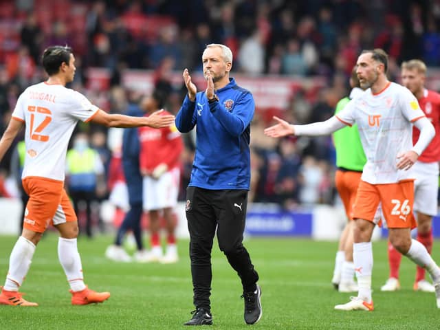 NOTTINGHAM, ENGLAND - OCTOBER 16: Blackpool Head Coach Neil Critchley applauds the Blackpool fans after the final whistle during the Sky Bet Championship match between Nottingham Forest and Blackpool at City Ground on October 16, 2021 in Nottingham, England. (Photo by Tony Marshall/Getty Images)