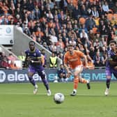 Jordan Rhodes scored a hat-trick in Blackpool's victory over Reading