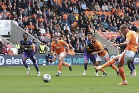 Jordan Rhodes scored a hat-trick in Blackpool's victory over Reading