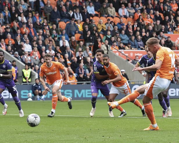 Jordan Rhodes scored a hat-trick in Blackpool's victory over Reading
