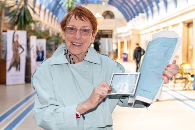 Barbara Patricia George with a photo and programme from when she first competed at the Blackpool Dance Festival in 1957. Photo: Kelvin Stuttard