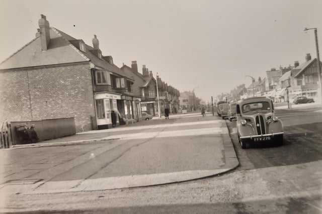 Looking in a seaward direction, this photo shows shops on Victoria Road West on the section of road east of the tramlines