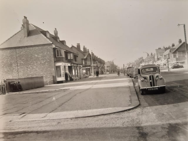 Looking in a seaward direction, this photo shows shops on Victoria Road West on the section of road east of the tramlines