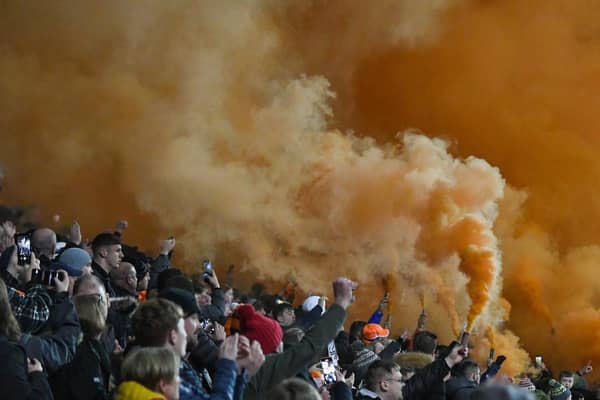 Tangerine smoke filled the air following the tribute to Tony Johnson