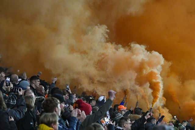 Tangerine smoke filled the air following the tribute to Tony Johnson