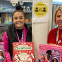 Jordana Collinge (right) and colleague with some of the calendars