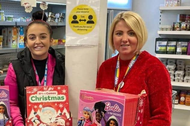 Jordana Collinge (right) and colleague with some of the calendars