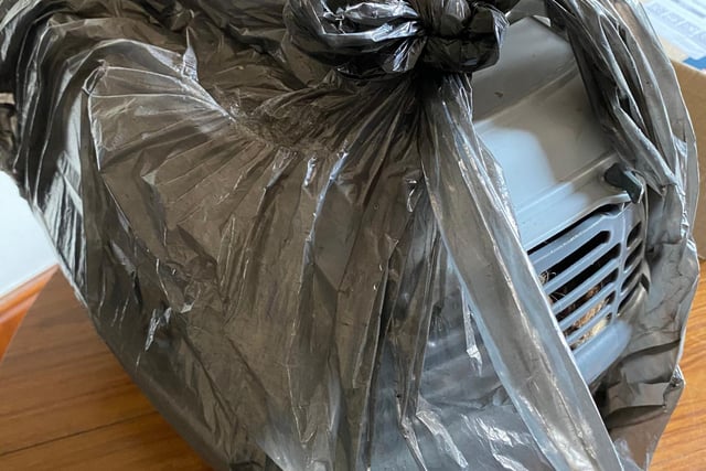 Carrier left covered with a bin bag.