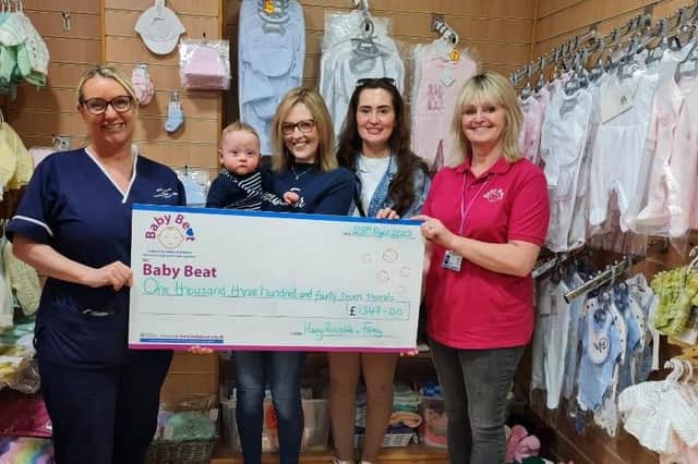 NICU senior sister Mel Gwilt receives the Baby Beat donation raised in Harry’s name from a thriving Harry himself. With Harry are, from left to right, Gan gan Lesley, mum Amber and Baby Beat’s Sue Swire