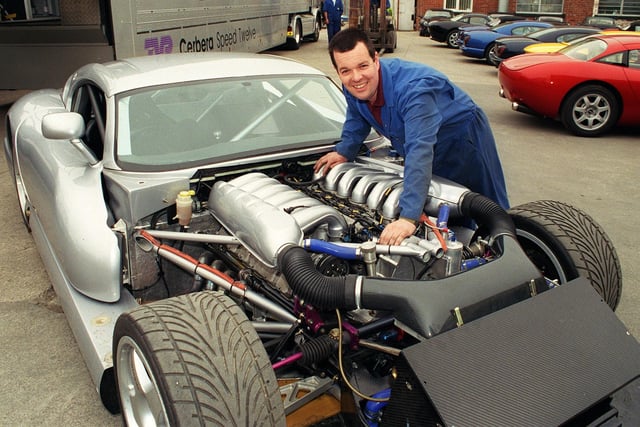TVR worker John Whitehead with a new TVR Cerbera speed 12 which was world's fastest production car. which has been unveiled at their factory in Bispham