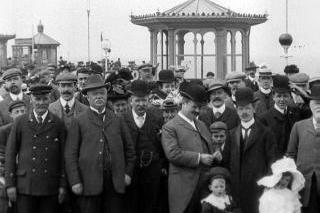 An undated scene of men in bowler hats packed on the jetty at North Pier