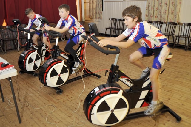 Indoor cycling at Singleton Village Hall. Pictured (from left to right): Dylan Benson, Alistair Leivers, and Adam Hartley