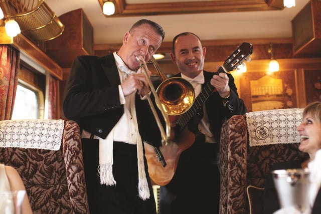 On song ... the train's resident musicians entertain passengers