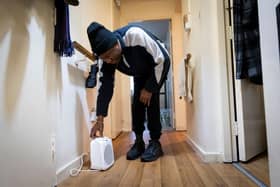 Man adjusts dehumidifier