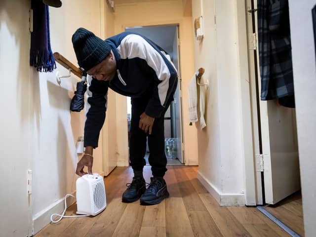 Man adjusts dehumidifier