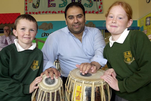 Ben Churchman and Bethany Myerscough taking part in an Asian music workshop with Asif Iqbal from Lancashire Music Service at Carleton CE primary school