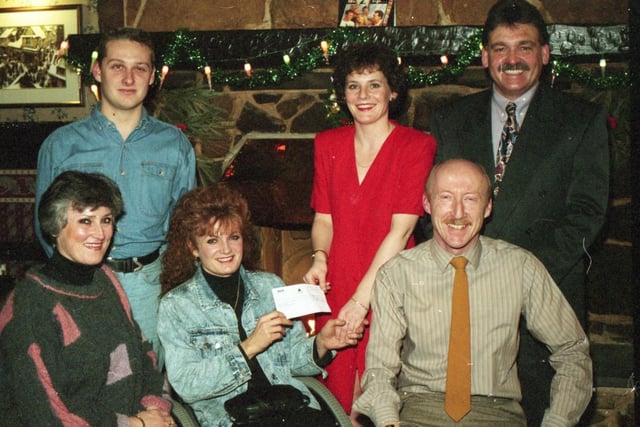 Bass Taverns has donated £250 towards the cost of a special skiing holiday. Pictured, from left are disabled ski guide Maree Newton, disabled skiers representative Diane Williams and disabled ski guide Alan Newton. Standing, from left: Dave Holland, disabled ski guide; and Carol McCann and Alfred Ager, landlord and landlady of the Pickwick Tavern, Lytham Road, Warton