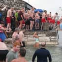 Taking the plunge during the charity New's Year Day swim in Carnlough harbour.