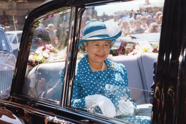 The crowds watch on as the Queen arrives at Rossall School in 1994